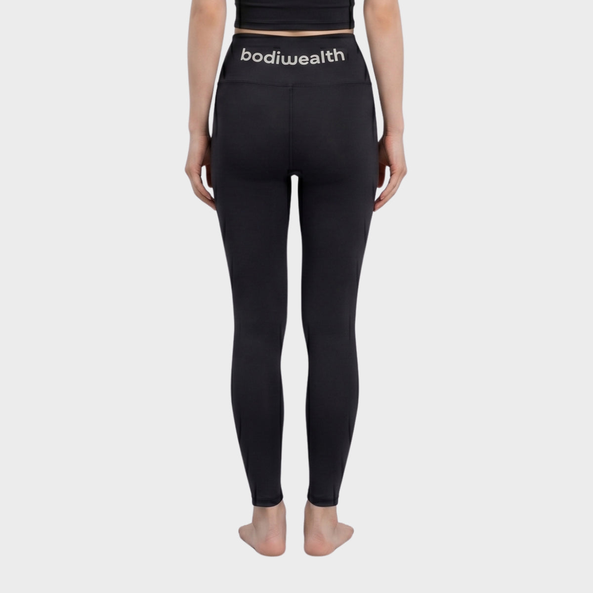 Bodiwealth Black high waist yoga leggings, model back