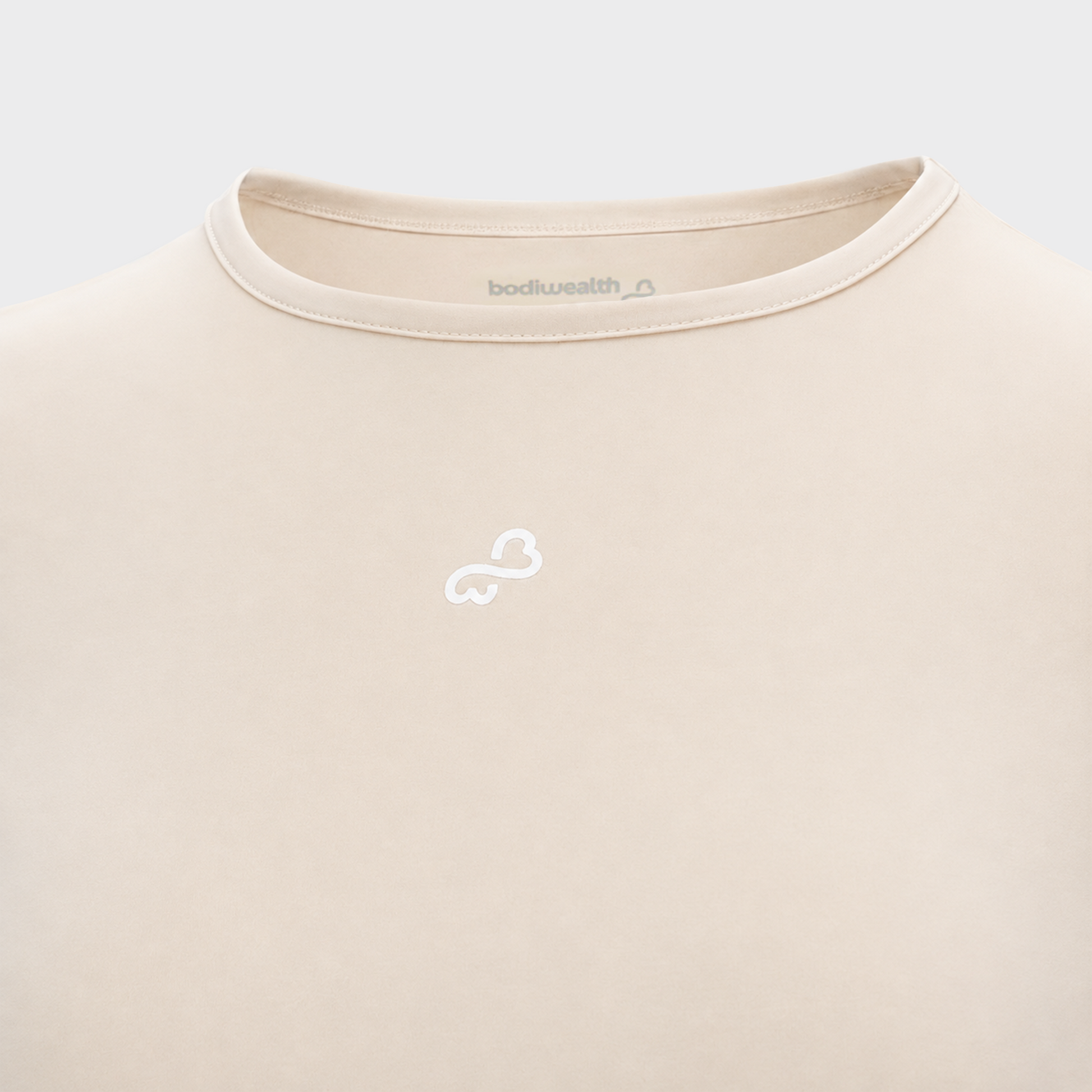 Bodiwealth Cream athletic tee, front logo detail