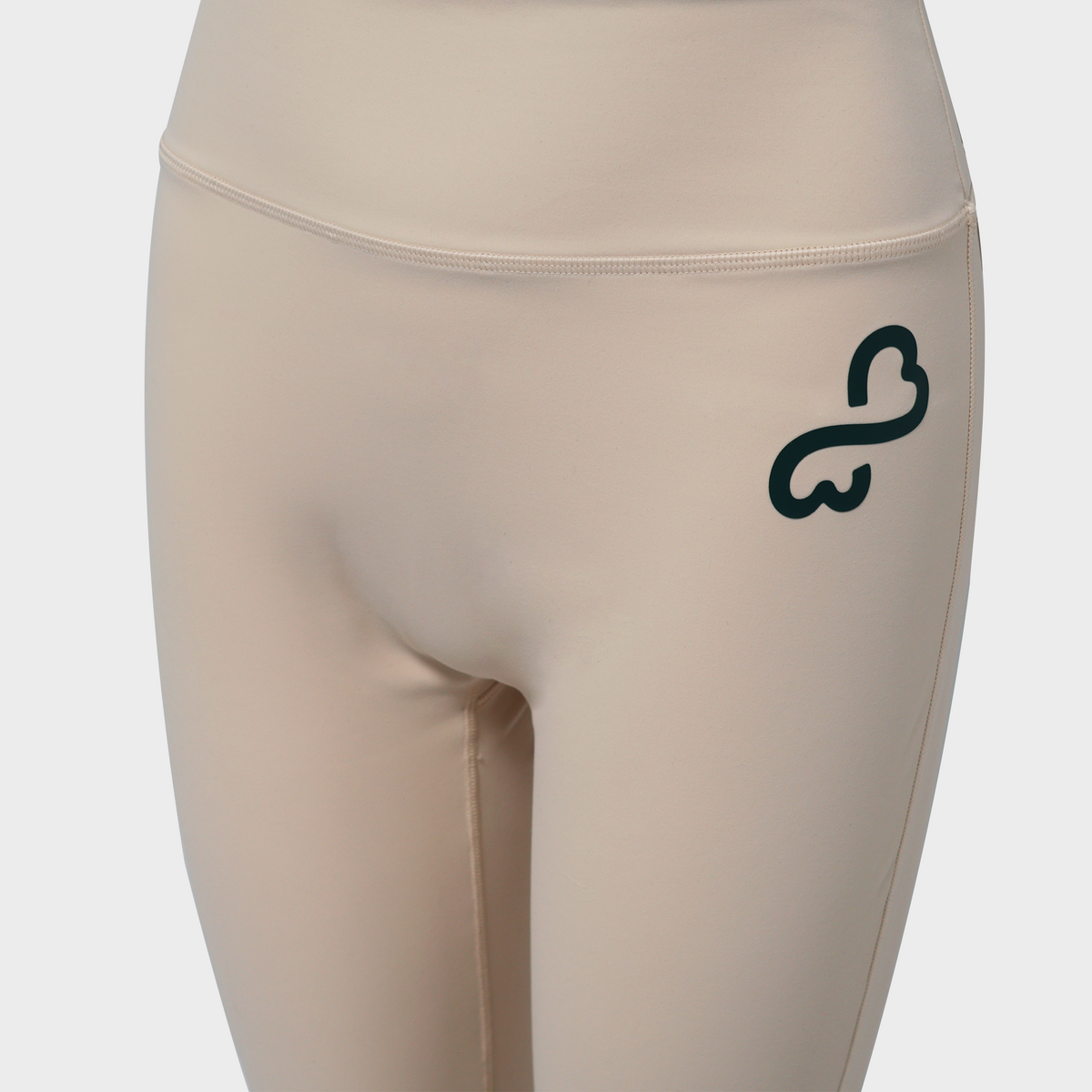 Bodiwealth Cream yoga pants, front logo detail