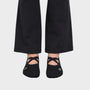 Bodiwealth Black cross strap yoga socks, front on model