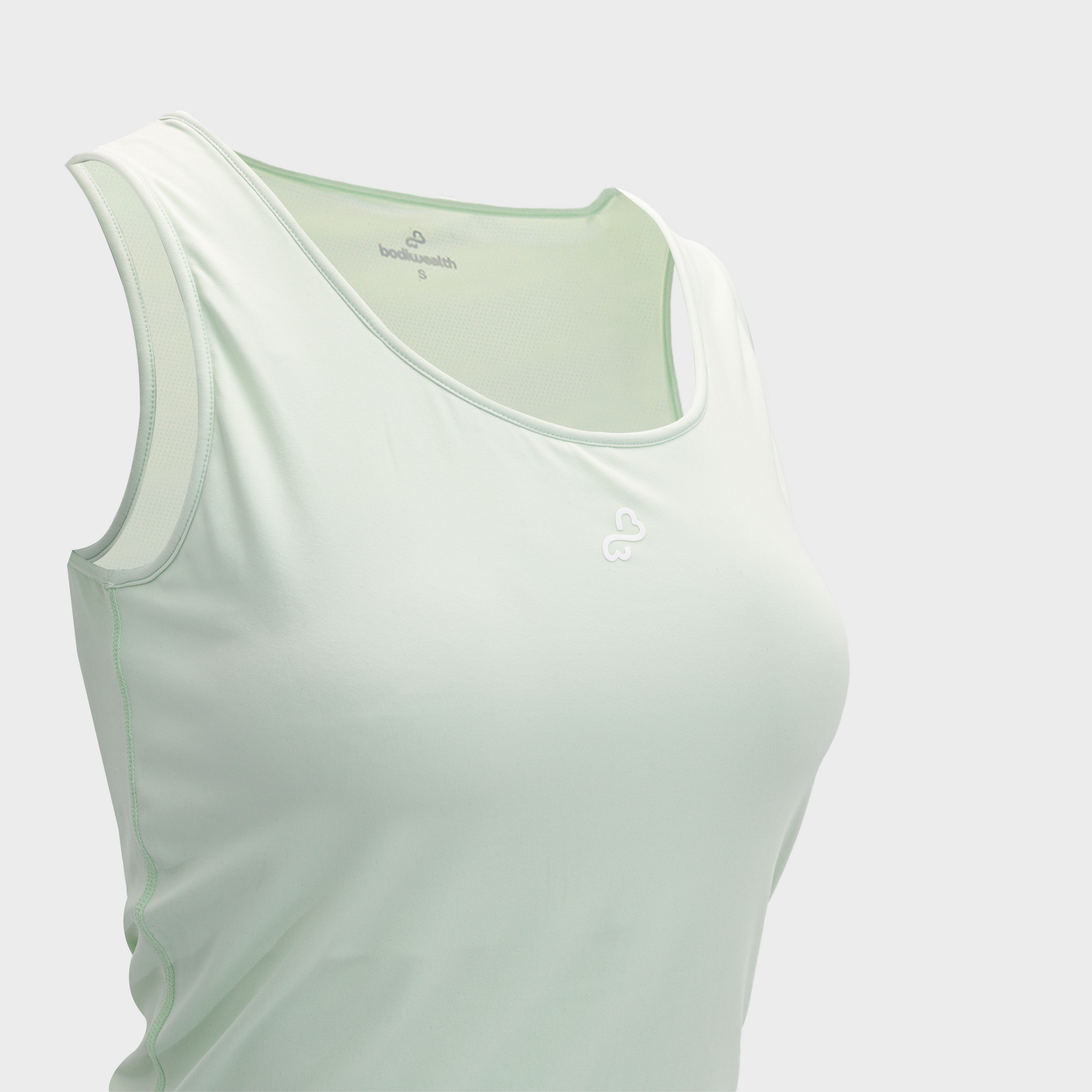 Bodiwealth Light Sage slim sports tank, Front neckline and logo detail
