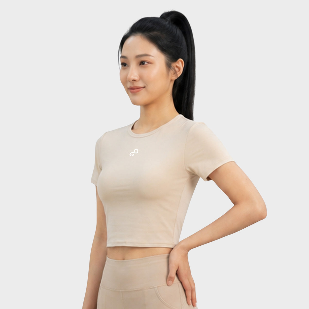 Bodiwealth Cream athletic tee, model side
