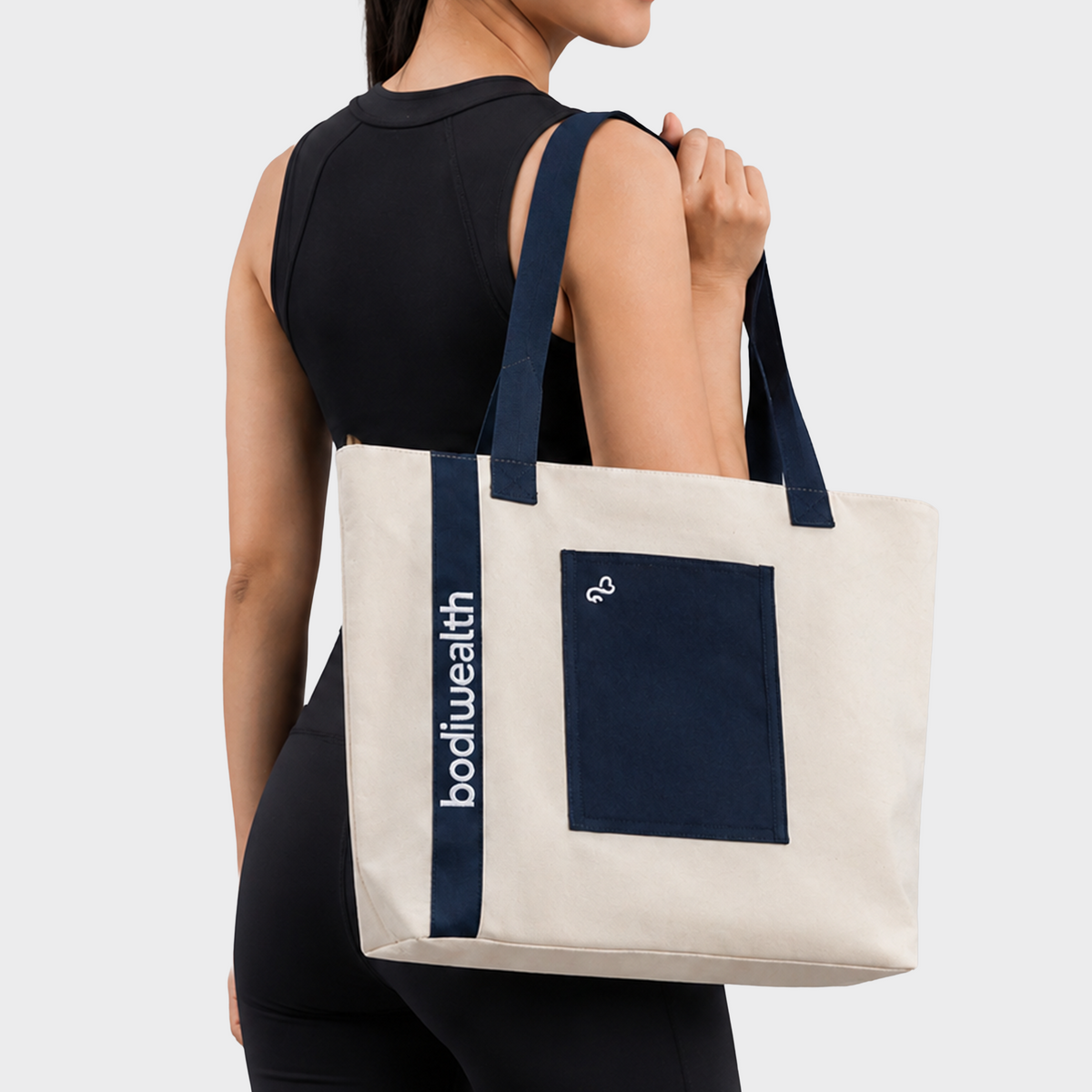 Bodiwealth Deep Blue yoga tote bag with mat holder, back on model