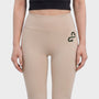 Bodiwealth Cream yoga pants, model front detail